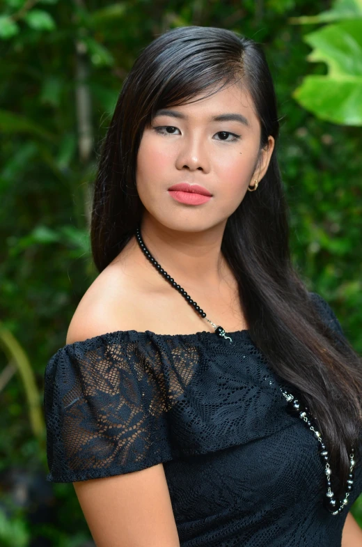 a woman in black dress posing for picture