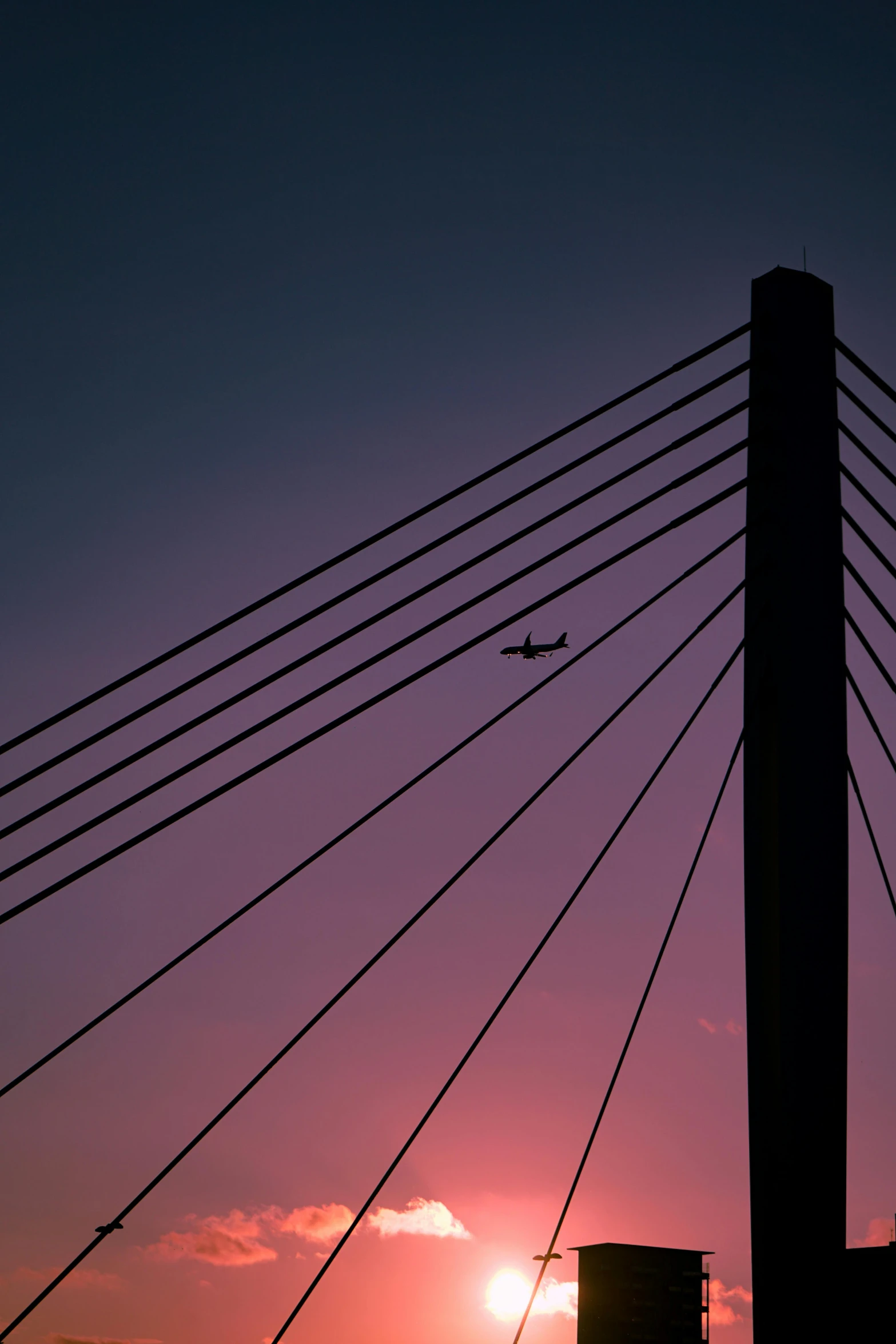 a plane is flying over a large structure