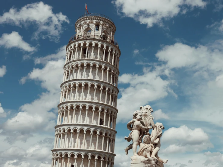 the view from below, of the leaning tower and statue