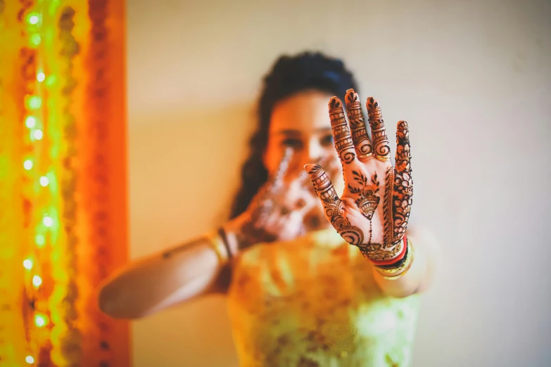 a woman wearing a  with her hand open