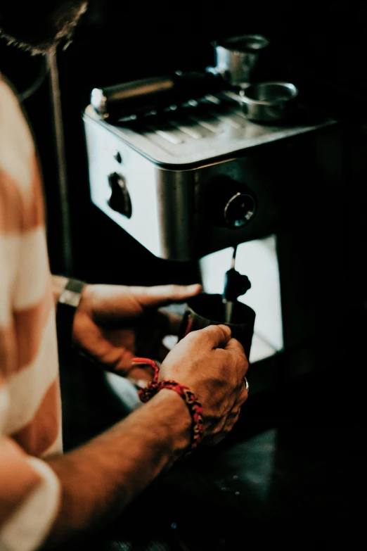 a person is cooking food in front of an oven