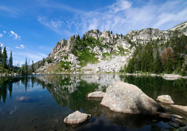 a body of water surrounded by mountains