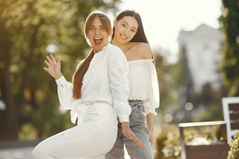 a couple of women standing next to each other