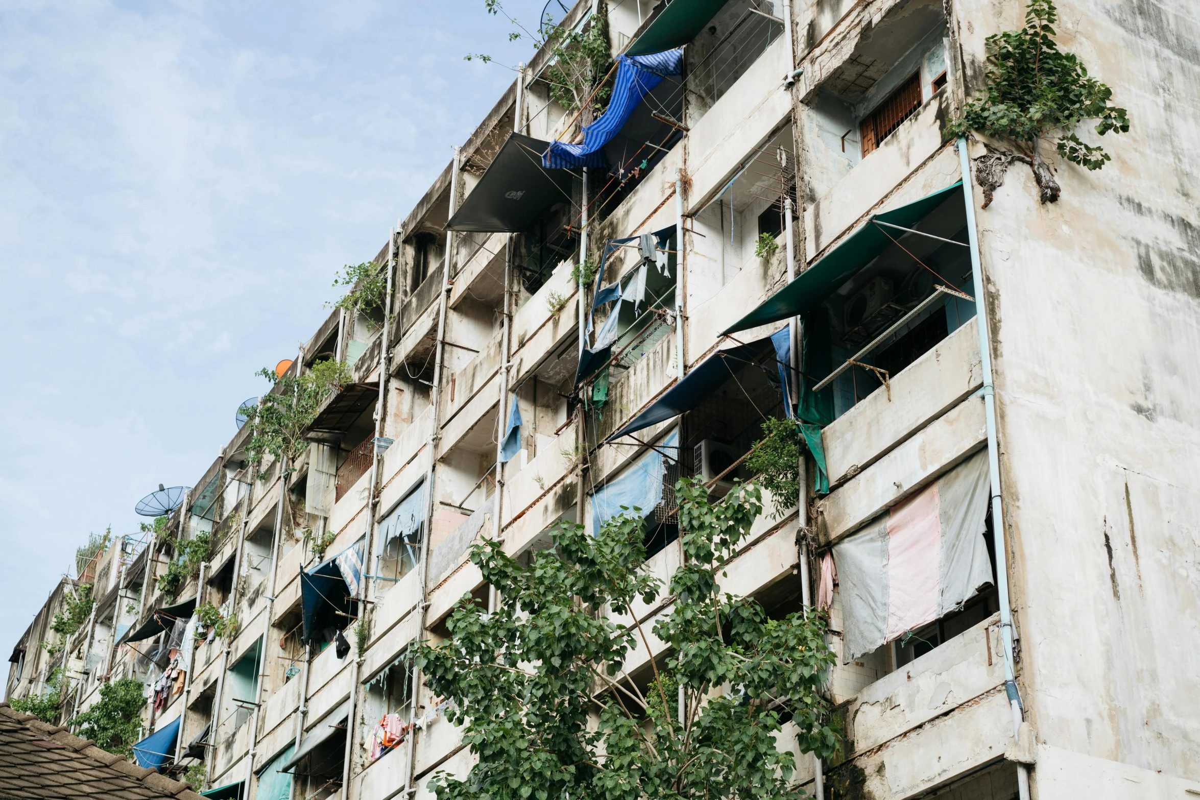 a very tall apartment building with a bunch of windows