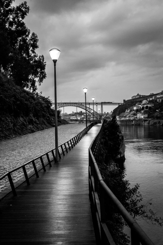 the walkway runs along a body of water