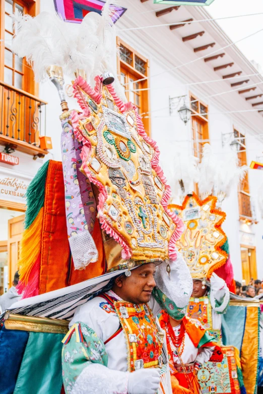 a man in a costume walks down the street