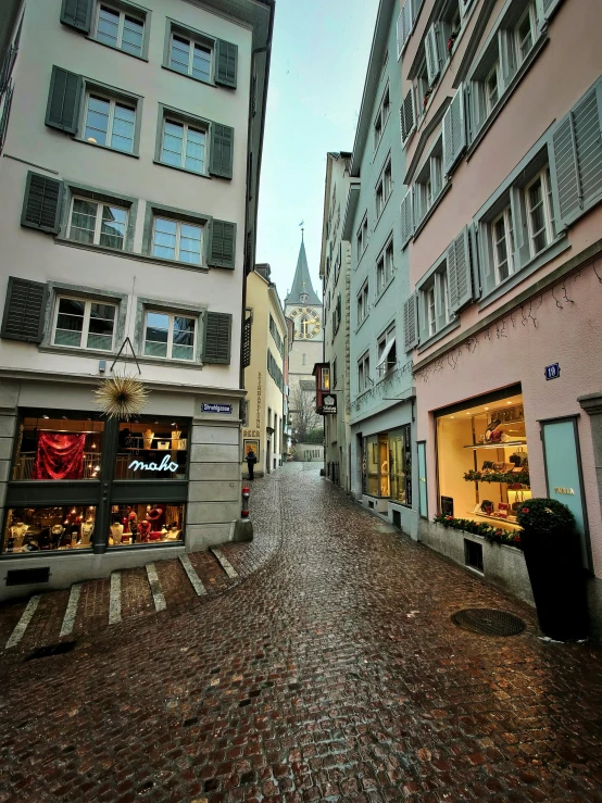 an empty brick street in a european city