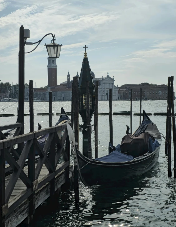 a boat is docked with the city in the background