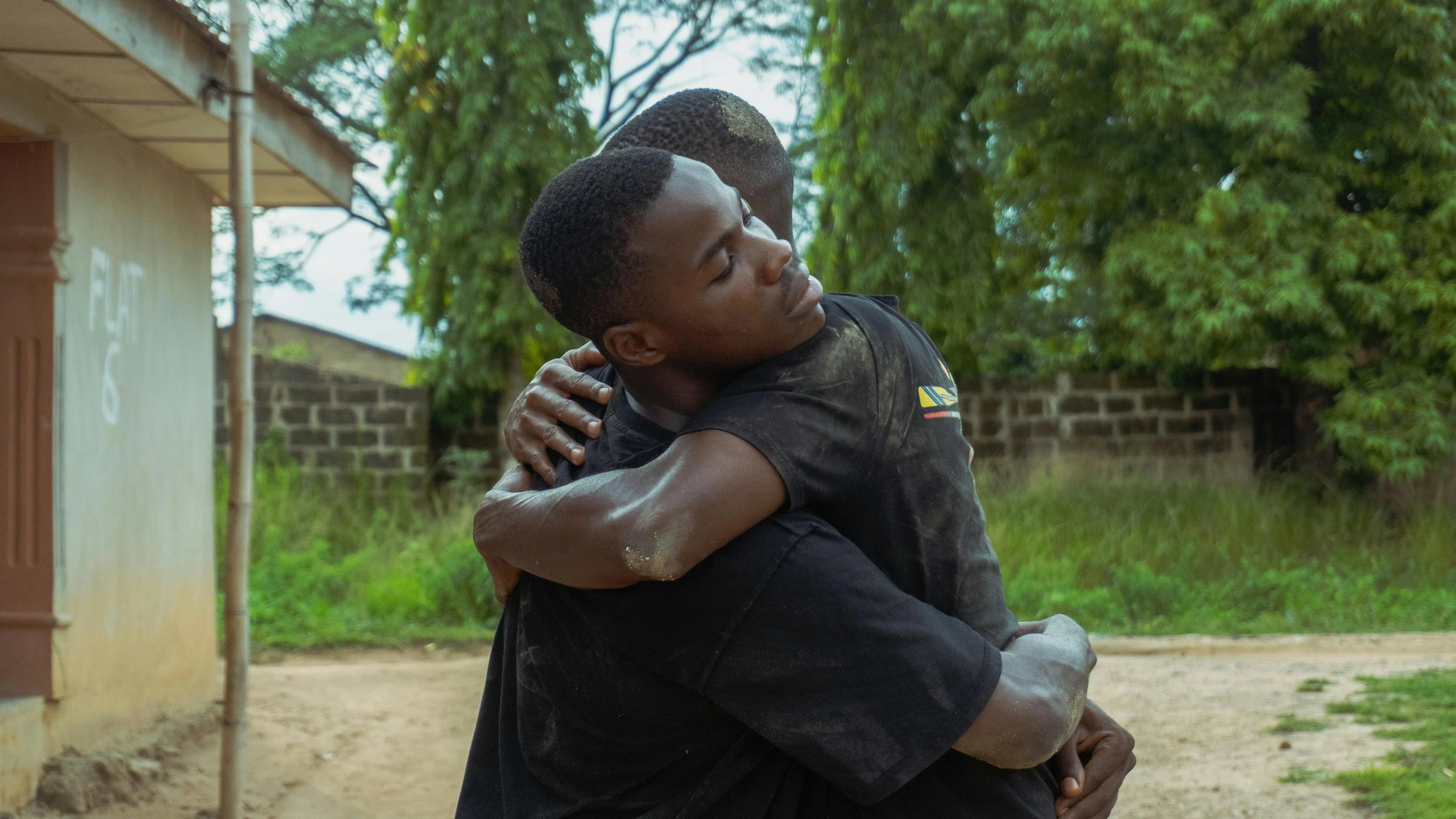 the man is hugging the woman with a hug