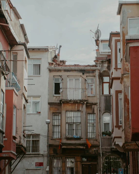 the old buildings line up behind the street in this old part of town