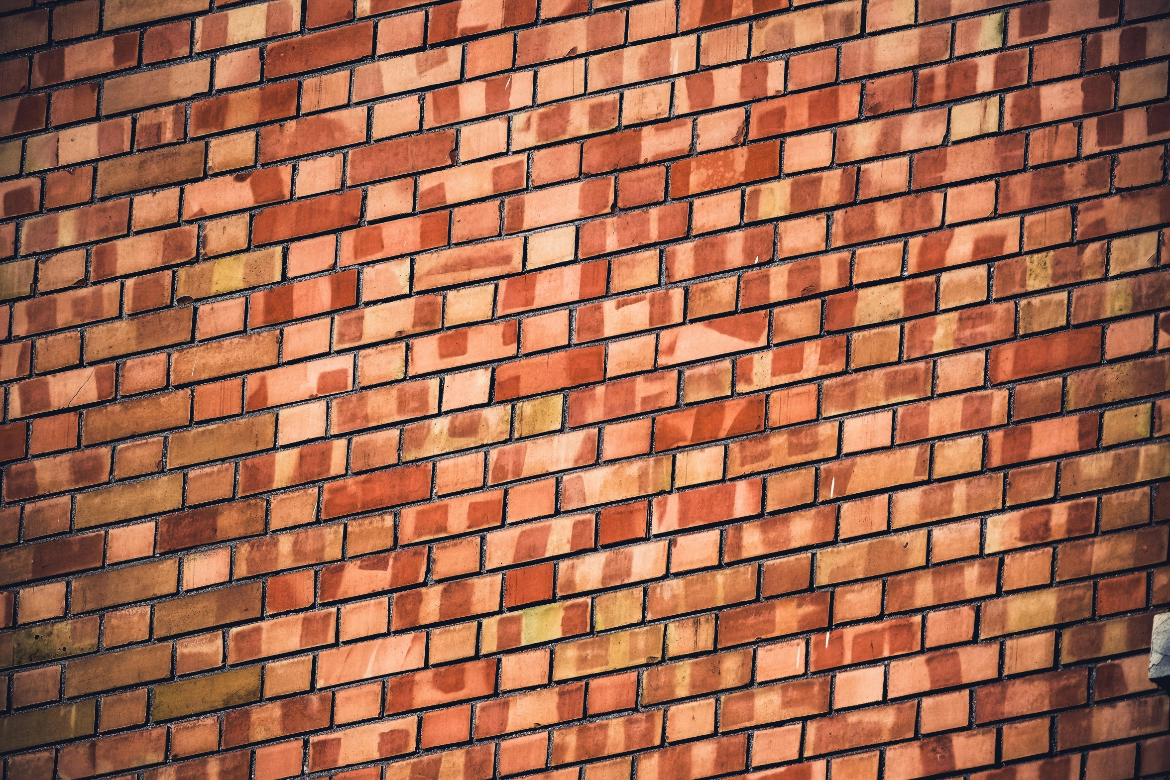 a brick wall is made of red bricks