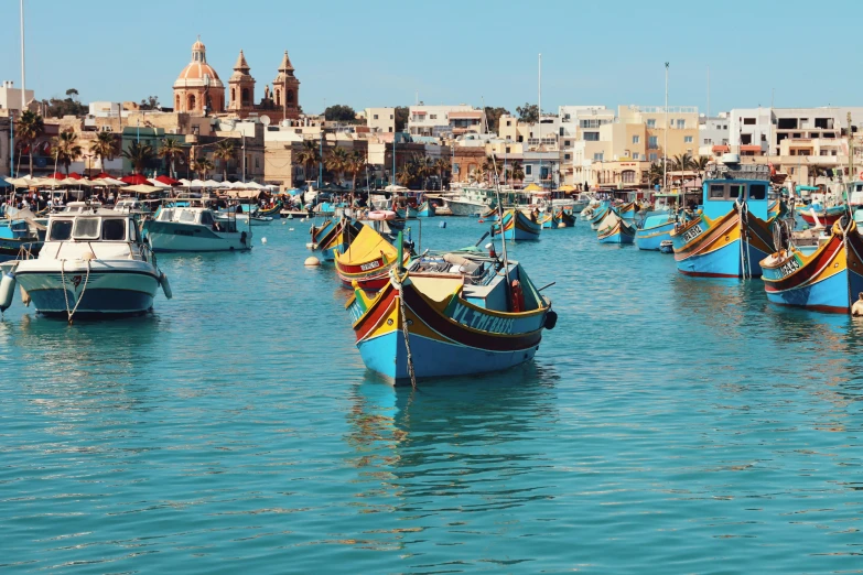 several boats in the water near buildings