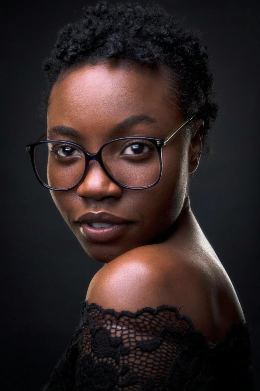 a woman in glasses posing for a po