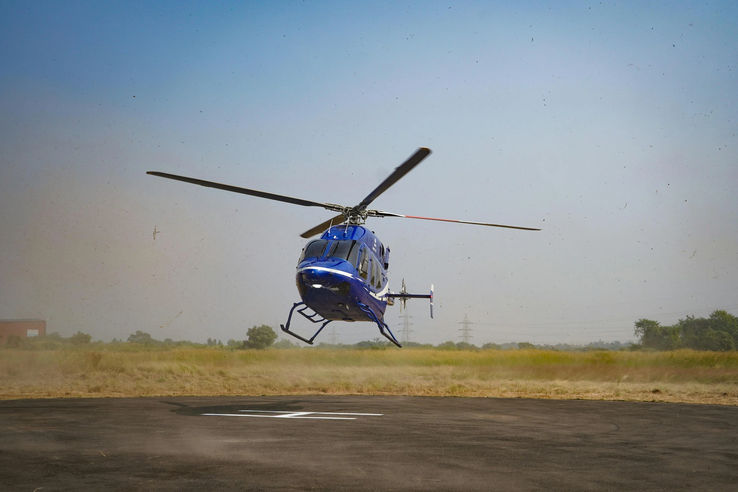 a helicopter flying low to the ground