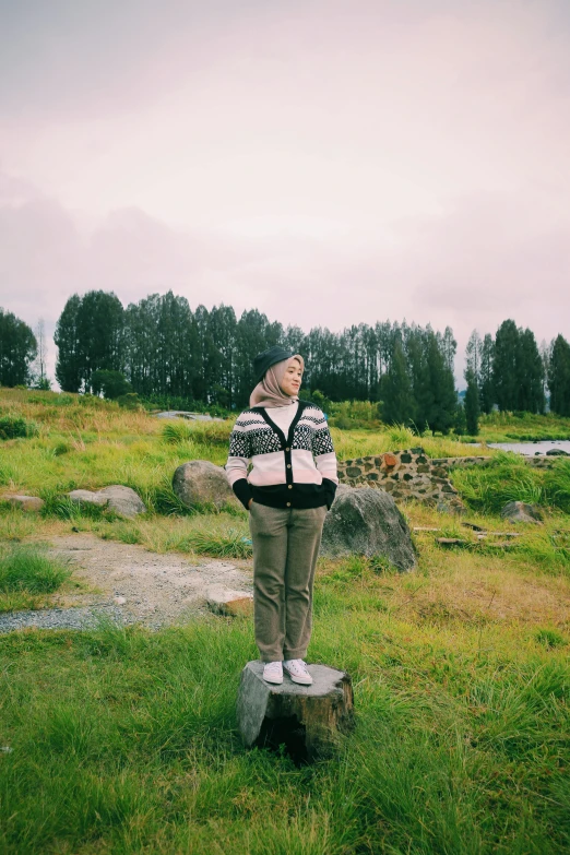 a person standing on top of a rock