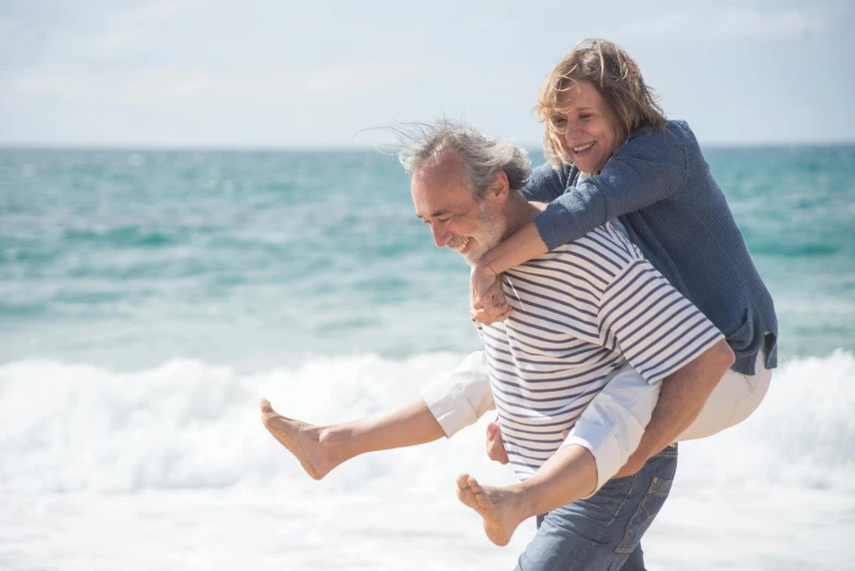 a man carries a child on his back