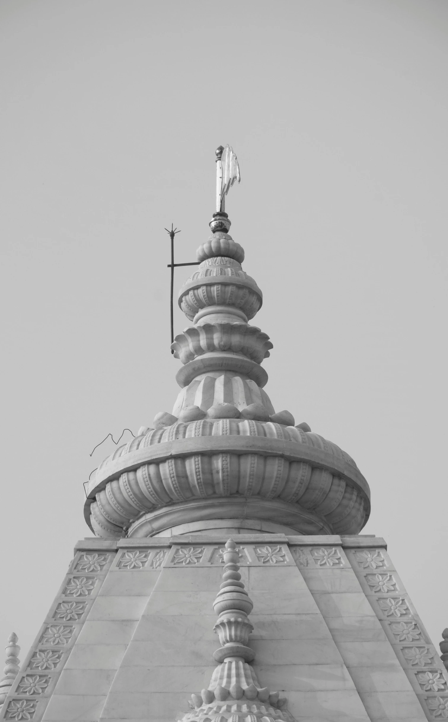 a tall cross on top of a church