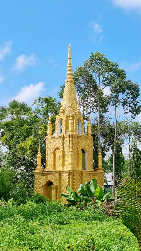 a church in the middle of a green hillside