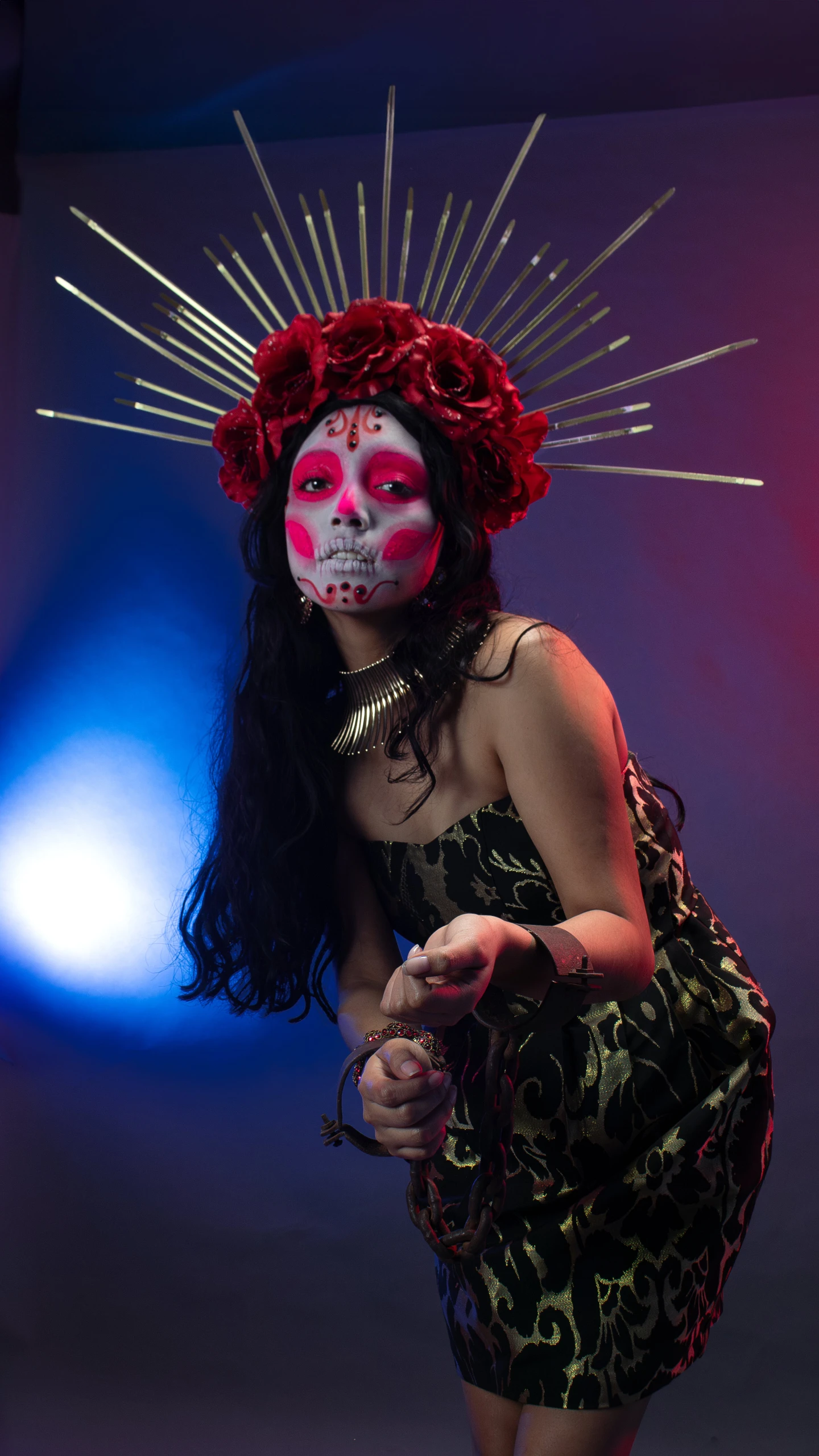 a woman in black and red with a fake face