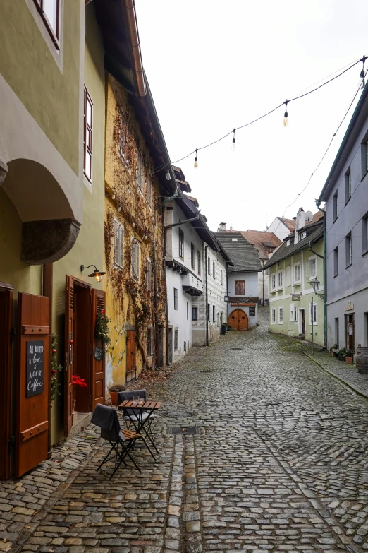 an old european street with cobblestone in a town