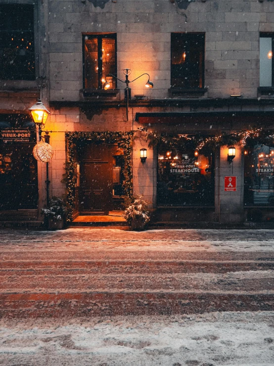 two buildings that are lit up during the winter season