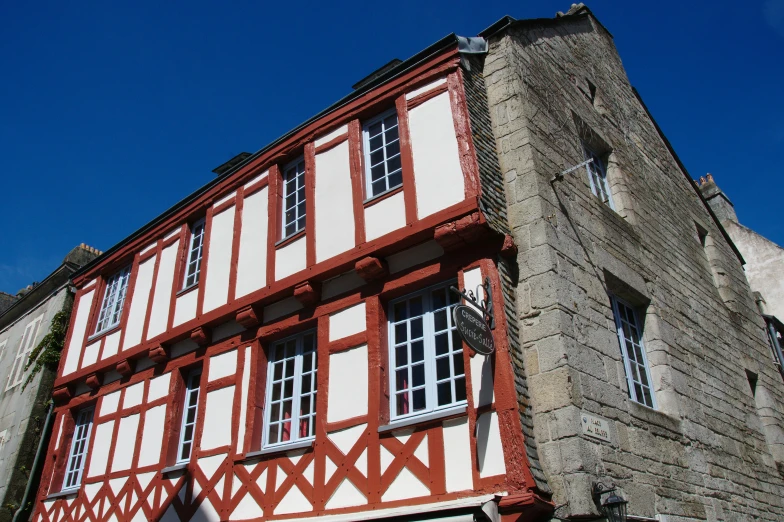 an old building with two stories and several windows