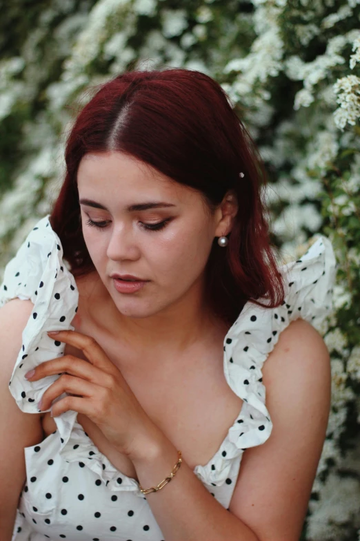 a girl in a dress on her cell phone