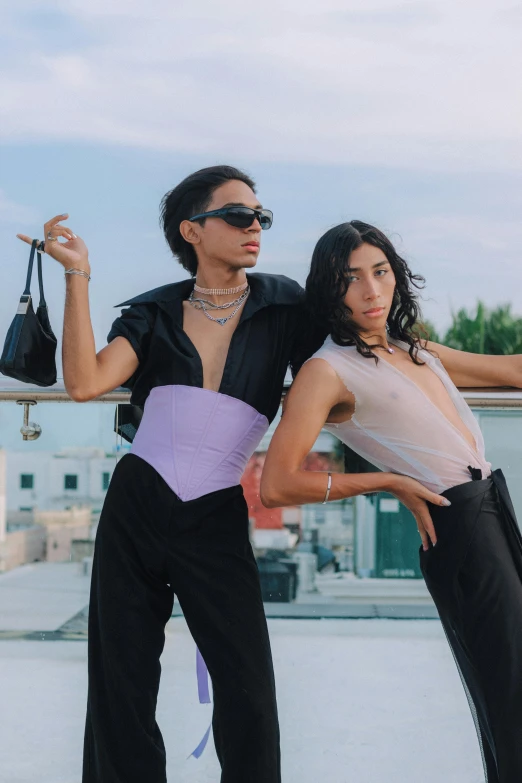 two young women are posing on the roof