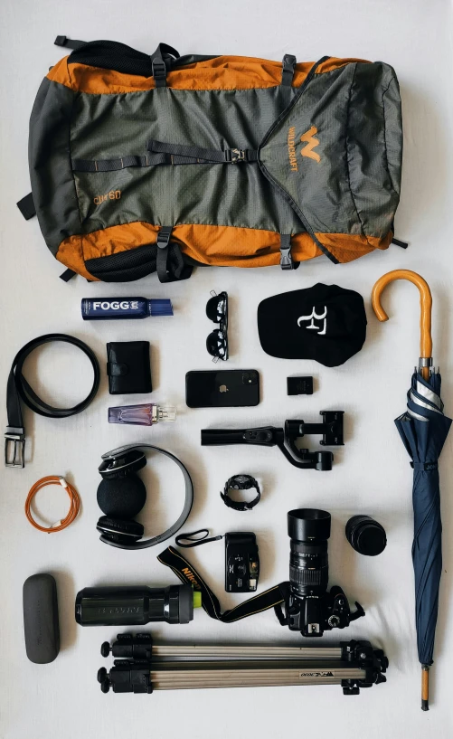 the back pack includes an umbrella, camera and many other things