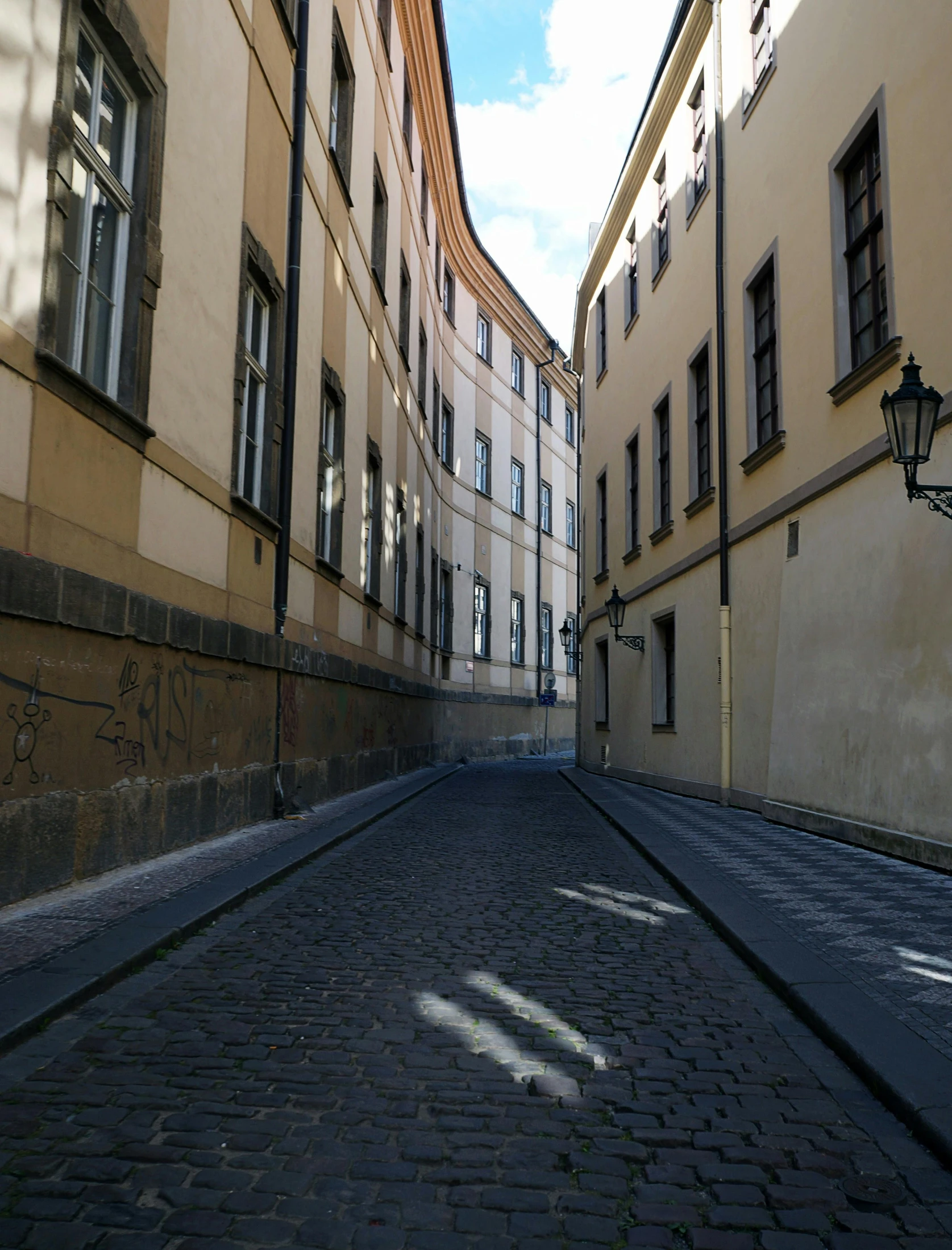 a narrow street with buildings on both sides