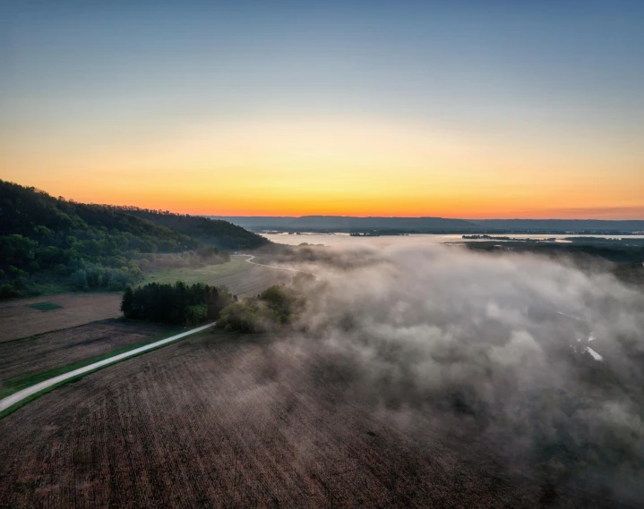 a very pretty sunset that is over some land