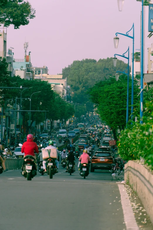 the motorcycle traffic is full and the people are riding