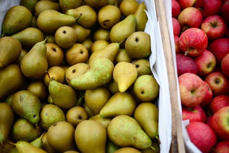 there are many pears and bananas stacked on each other