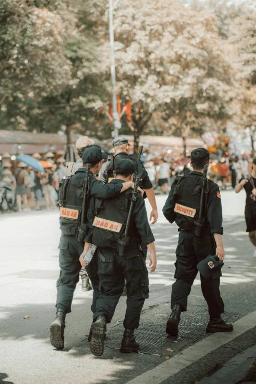 a group of police officers walking down the street