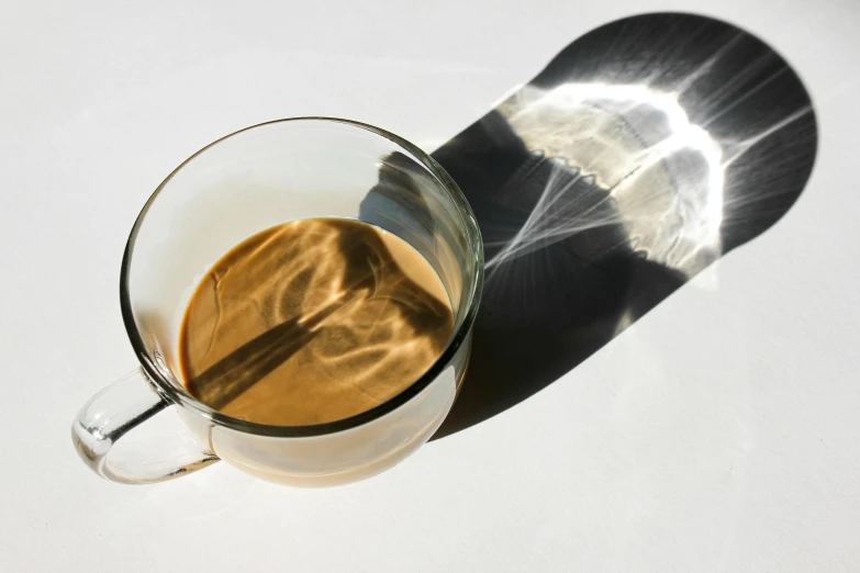 a cup of coffee sitting on top of a counter