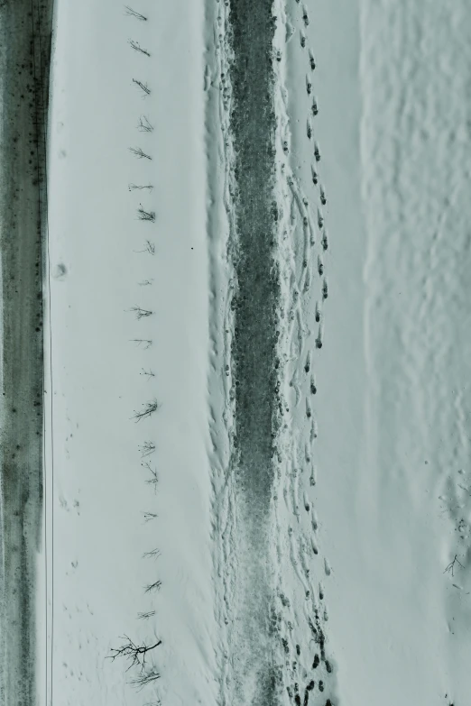an aerial po shows snow covered street and tracks