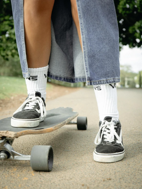someone with socks and high heels skateboards