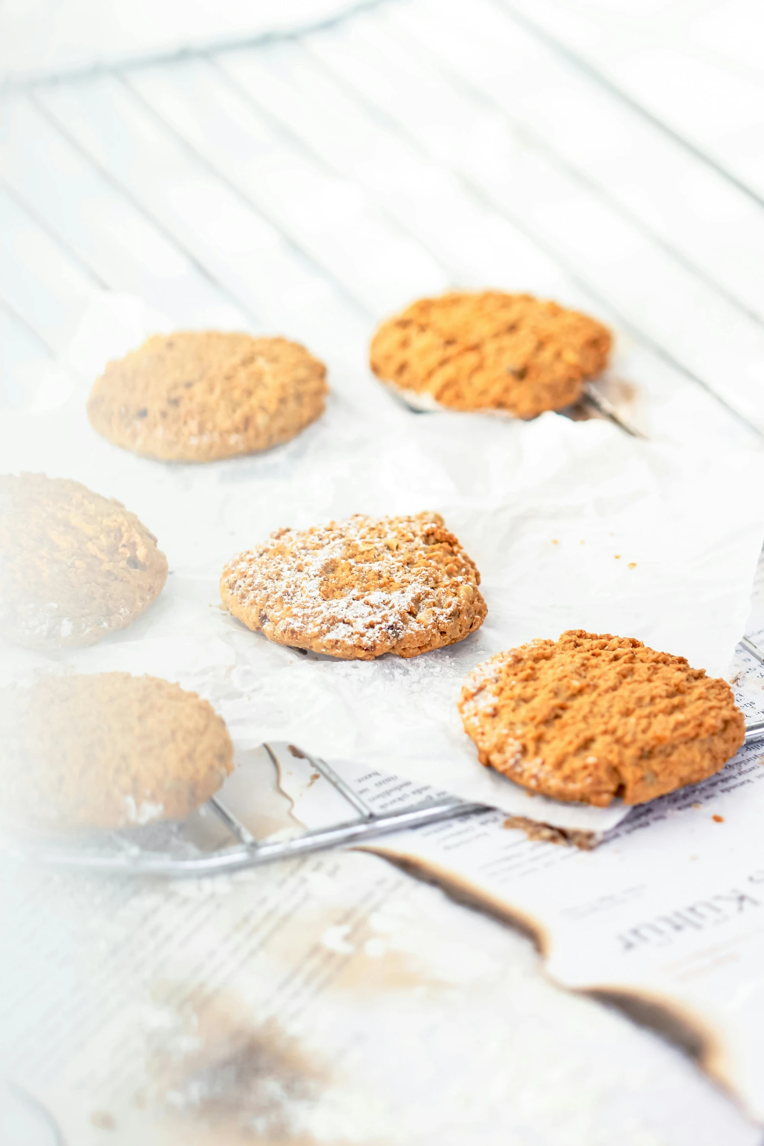 cookies in baking pans sit on a table