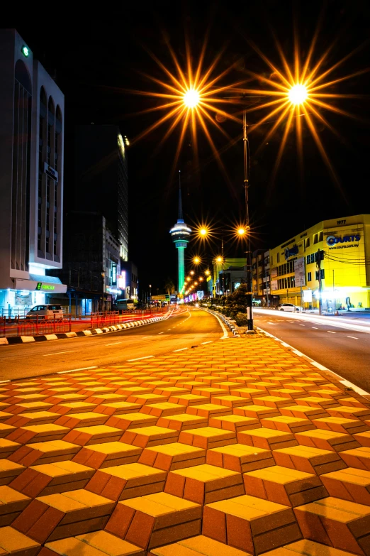 some street lights and lights shining above some buildings