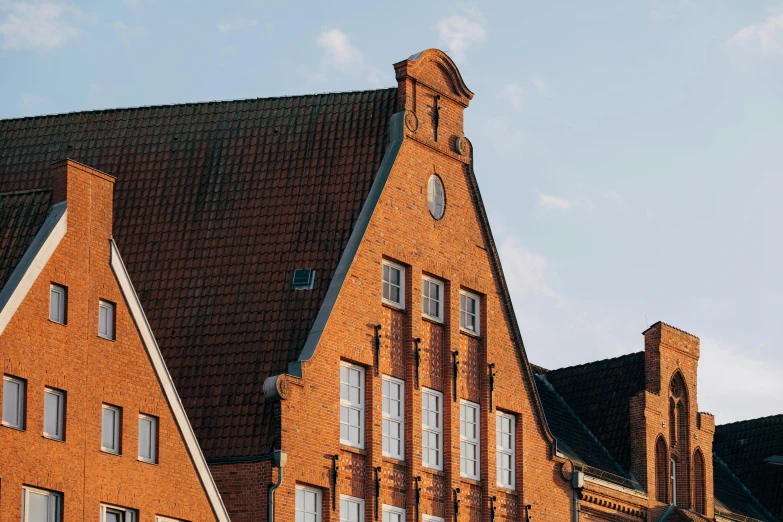 an old building with several windows and a clock on it