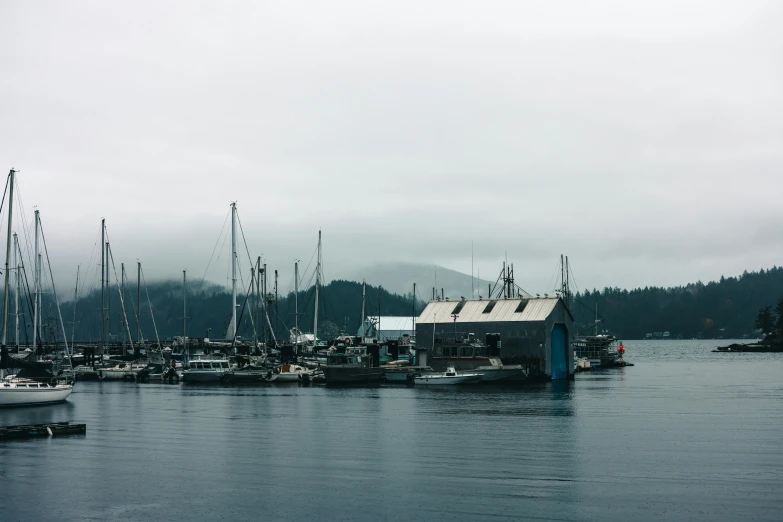 the small boat is parked beside the larger boat