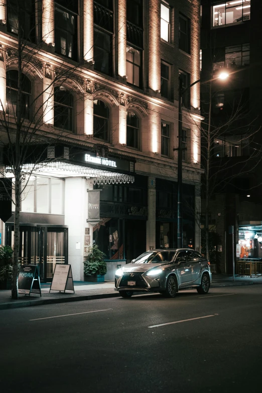 a fancy car parked on a street at night