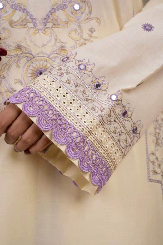 a close up of a person's hands holding soing