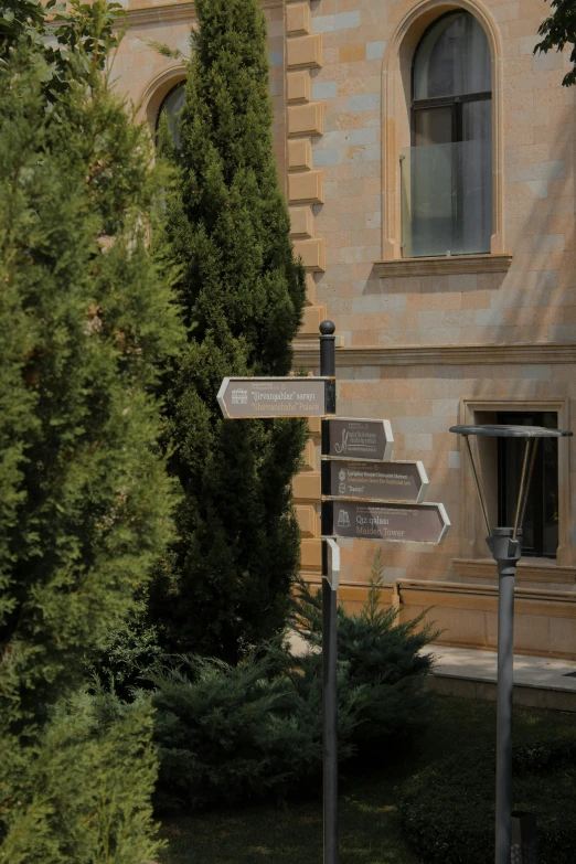 the building is stone and has many signs