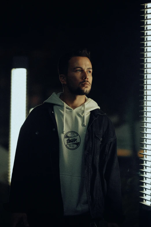 a man with dark hair and a white shirt