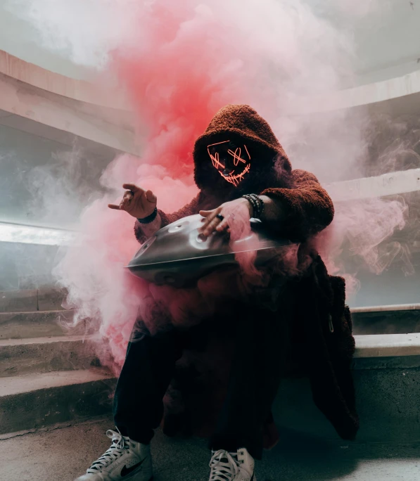 a person with a mask on, in smoke and gas
