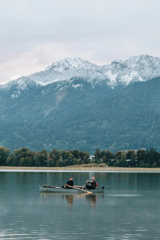 some people in some kayaks on the water