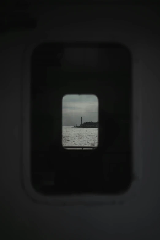 a window view from inside an airplane with a sky line and water