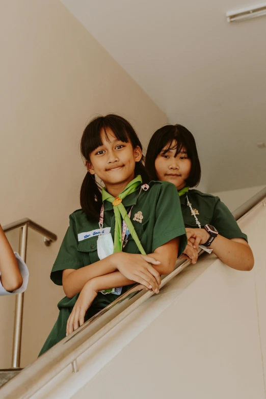 two asian girls on the balcony of an apartment building