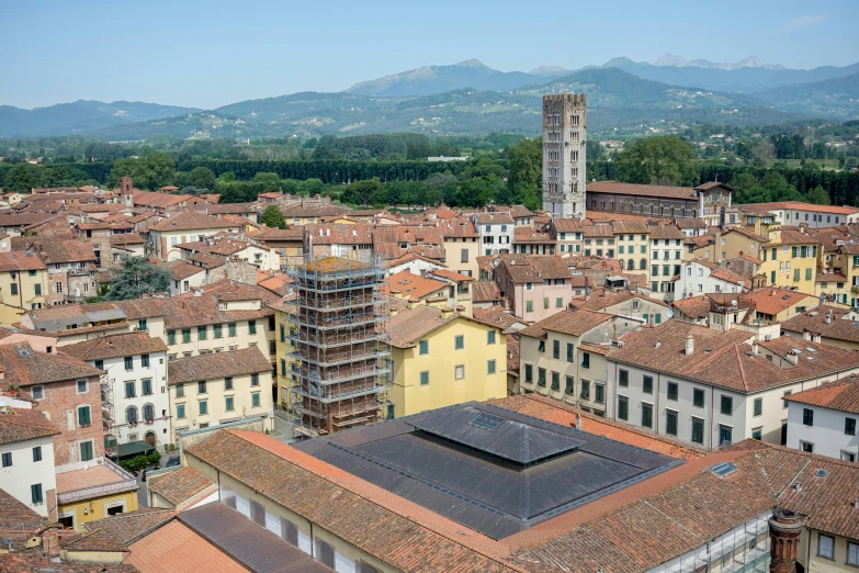 a city filled with lots of tall buildings with brown roofs